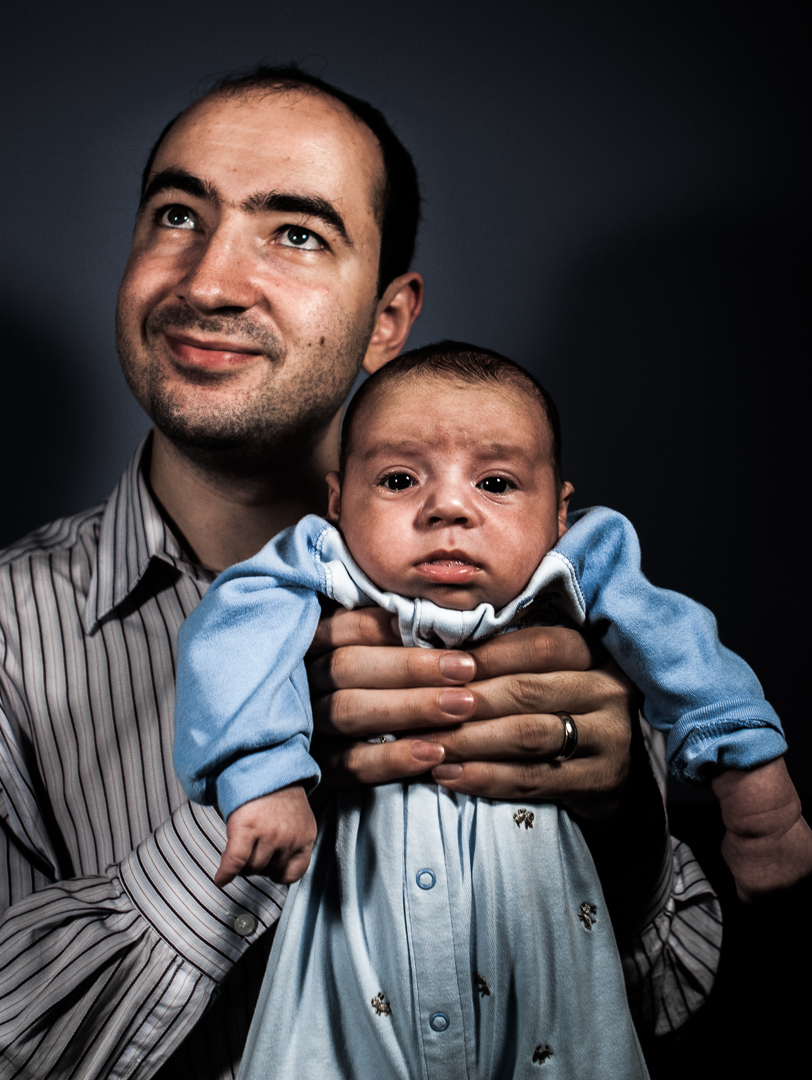 Father, Vladimir Khavulya, holding his son, Ari Khavulya. Brooklyn, NY. Model releases available.
