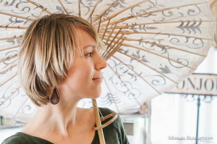 Young woman with an exquite sun umbrella