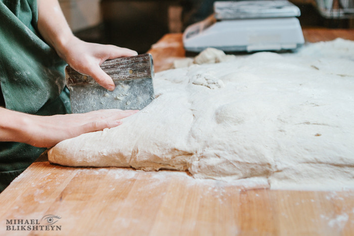 Shaping dough at a commercial artisinal bakery for baking