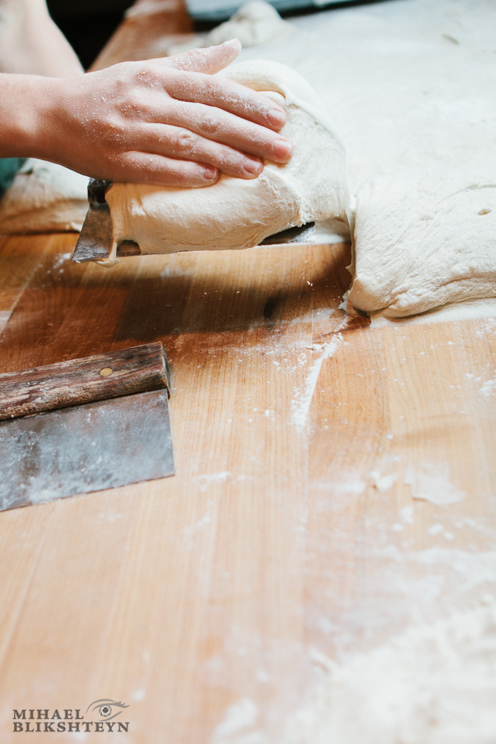 Shaping dough at a commercial artisinal bakery for baking