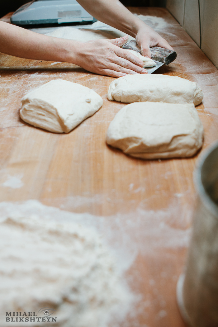Shaping dough at a commercial artisinal bakery for baking