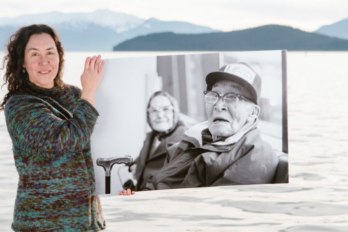 Melanie Brown with a photo of her great-grandparents, Anna and Paul Chukan